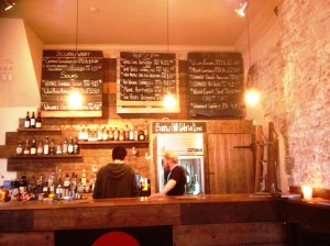 Blackboard strips list the beers on offer